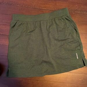 Size 14/16 Green skirt. Built in shorts. Built in pockets. Good condition.